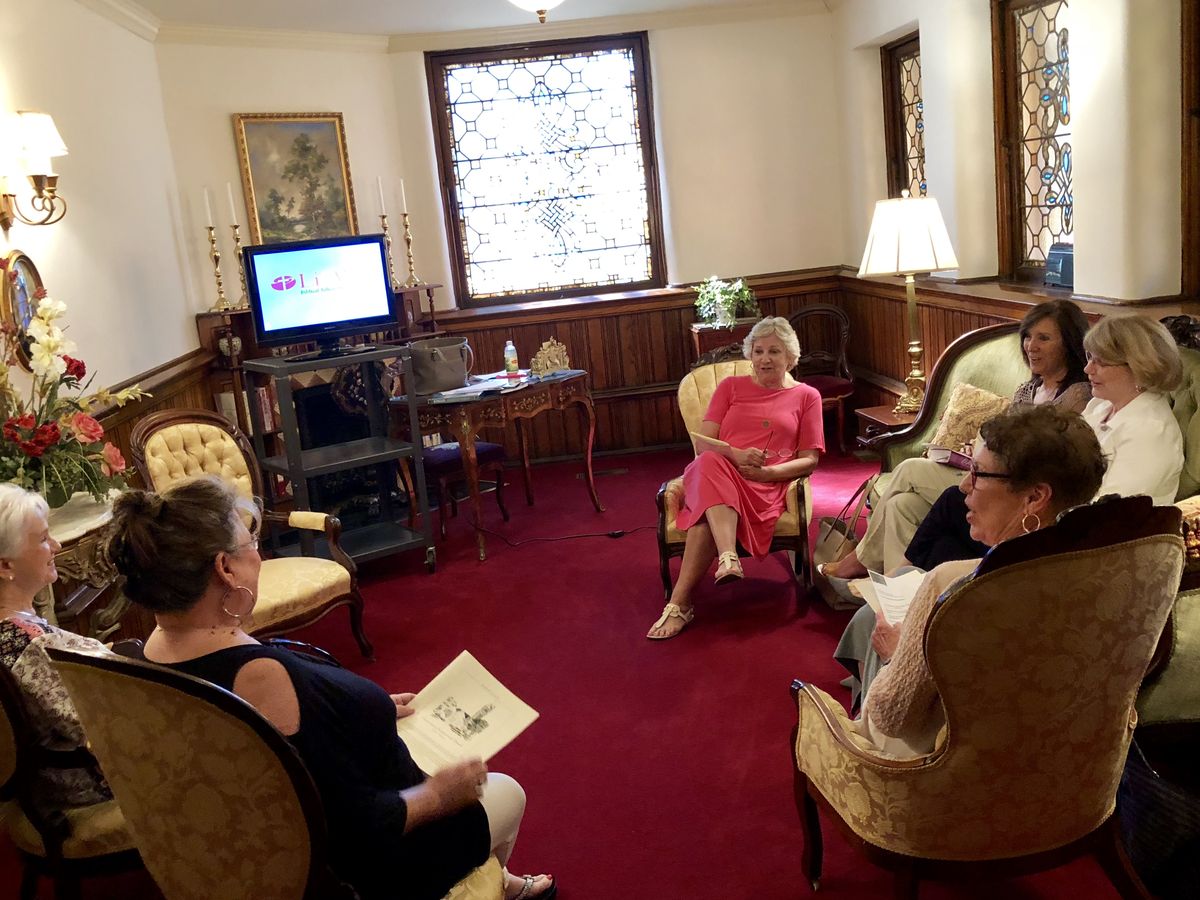 Members of an adult Sunday School class gathered in a parlor at Cornerstone